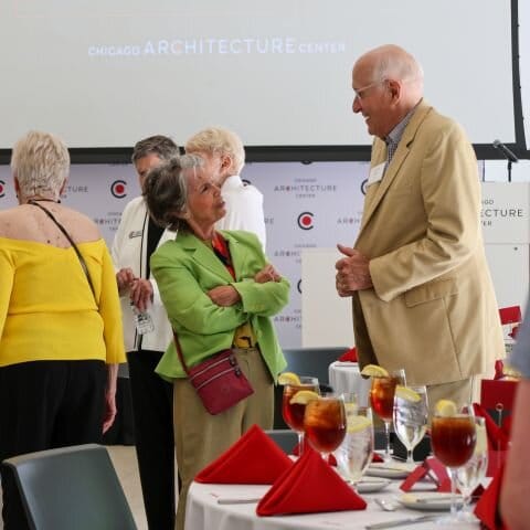 Two people standing and talking