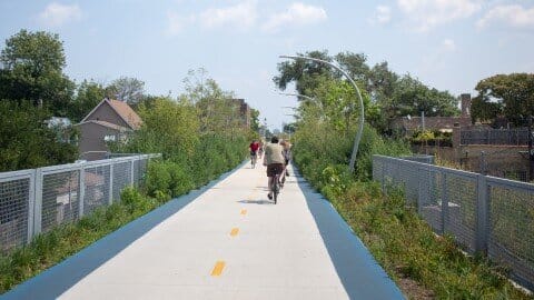 Photo of bikers on a suspended trail 