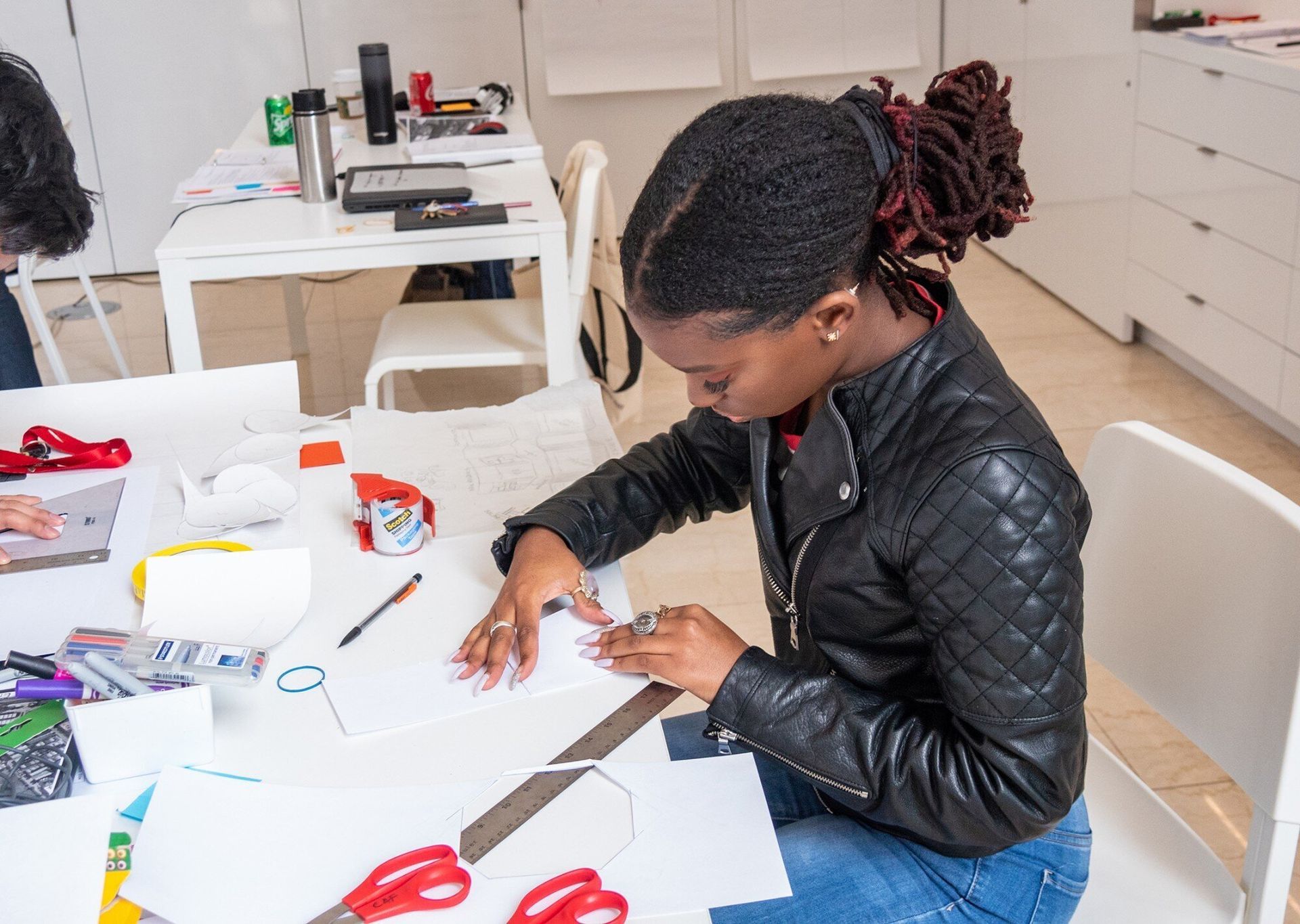Young black teen working on a craft