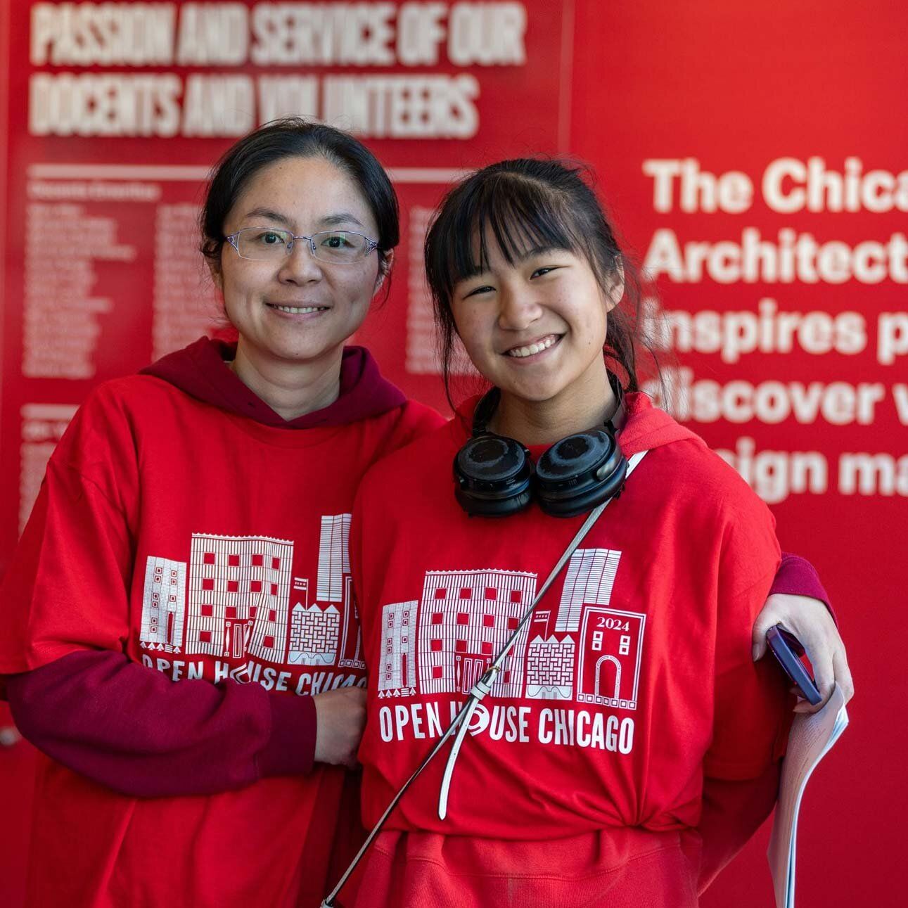 Two asian volunteers in red shirts that say Open House Chicago