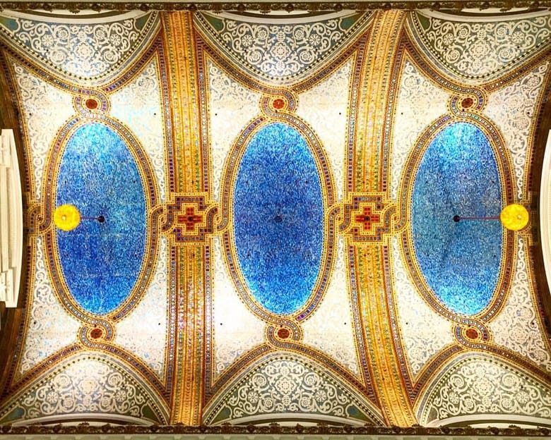 Blue, gold mosaic tile ceiling with red accents