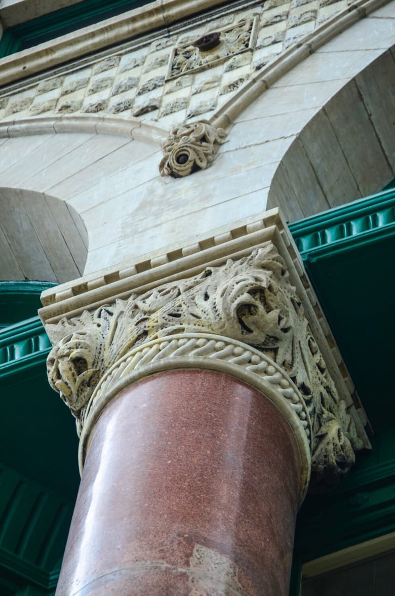 Top of reddish brown column with ivory cap and green trim