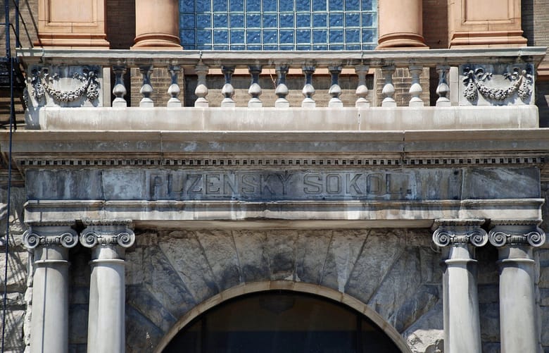Exterior of weathered stone building.