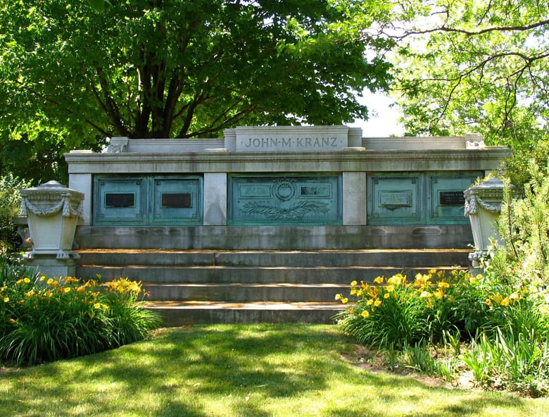 Stone and copper grave with "John M Kranz" engraved